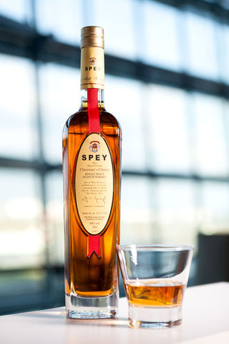 Brand photographer Simon Eldon, bottle of whiskey with a glass, shot in airport lounge