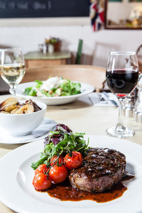 Food and Drink photography by Simon Eldon, steak and cherry tomatoes with red wine in cafe restaurant