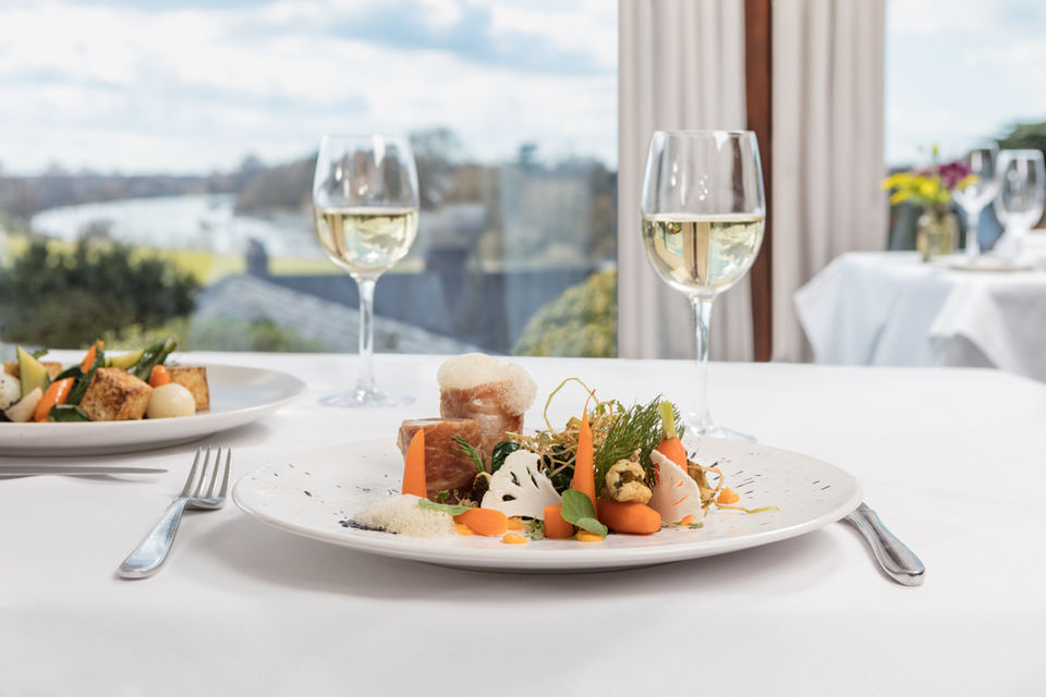 Food and Drink photography by Simon Eldon, main course at the petersham richmond with white wine, at a table with view over river thames
