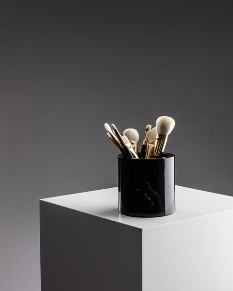 Brand photographer Simon Eldon, Mac makup brushes in black pot on white plinth