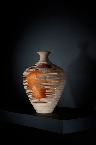 Product photographer Simon Eldon, artisit sculpture of a pot on dark background