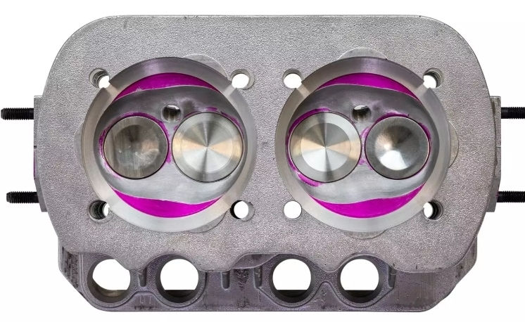 Close-up of dual-carburetor engine
