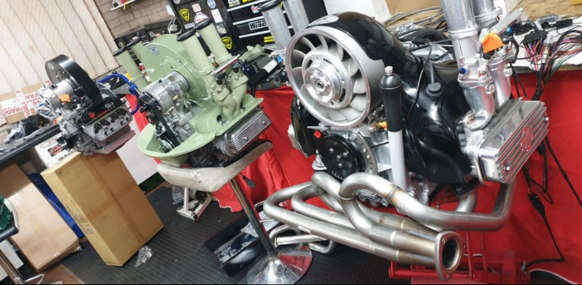 Thumbnail: VW Beetle engine parts: distributor, fan, and exhaust