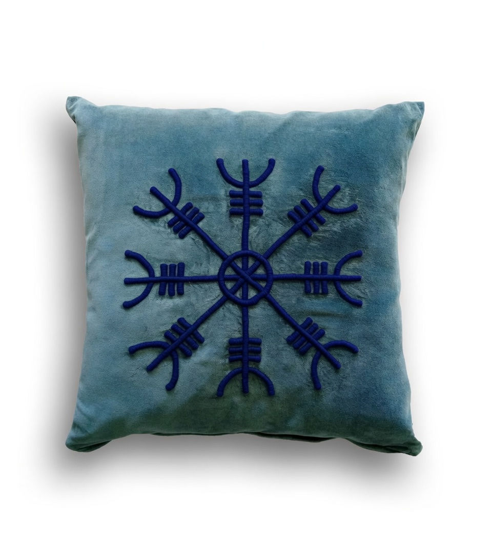 Light blue velvet cushion featuring a large, dark blue 3D-embroidered Vegvísir (Viking compass) symbol, isolated on a white background.