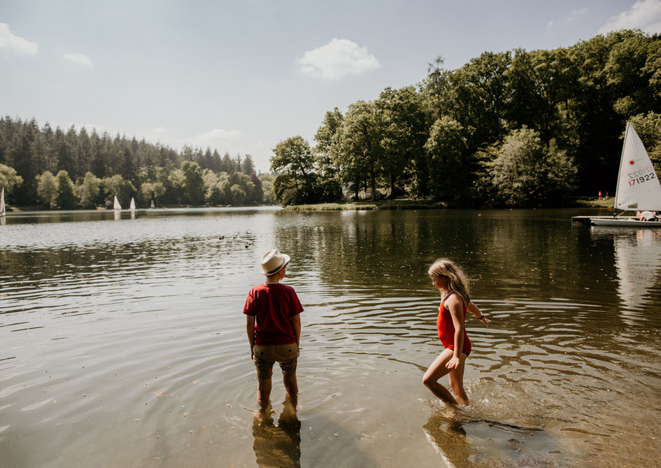 Two children playing in Shear water lake on a photo shoot 