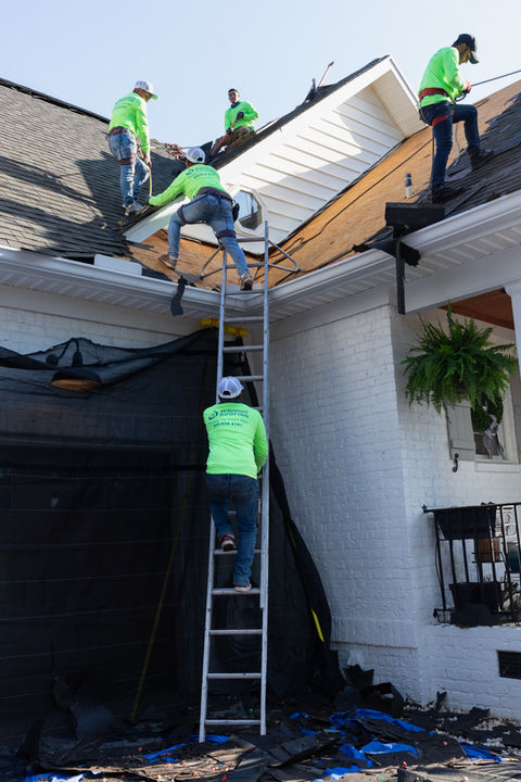The crew is working to quickly remove shingles and place new ones so we earn the title of amazing roofing contractors!