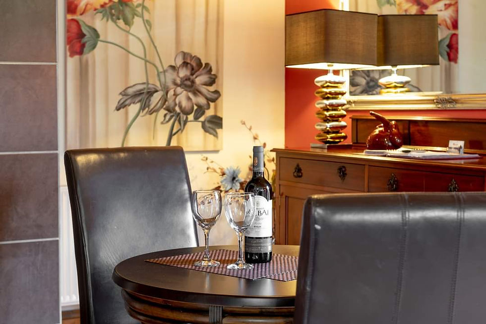 Discover Yorkshire Cuisine , stylish setting with a bottle of wine on the Table