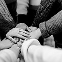 girl friends hands piled togethger_edite