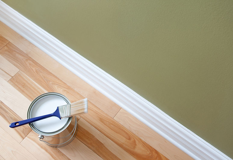 Green Wall and light wood flooring