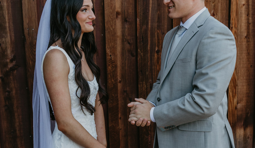 Bride and groom gaze at each other. Leah and Anthony's Summer Wedding at Sugar Pine Barn. Washington state wedding photographer.