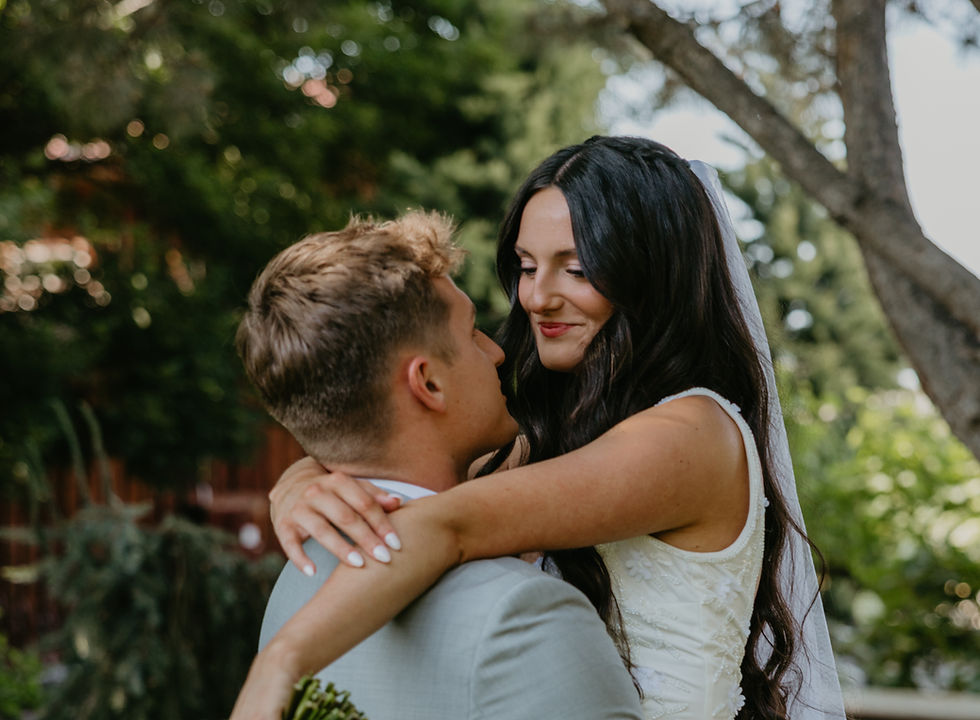 bride and groom looking into each others eyes