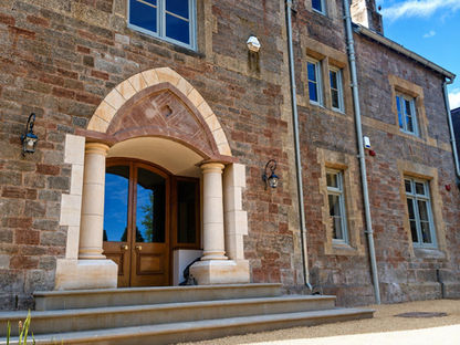 Stone pillars on large stone door entrance