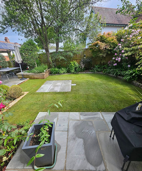 New lawn with small patio section