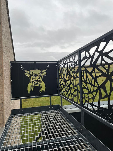 Metal barrier with highland cow engraved