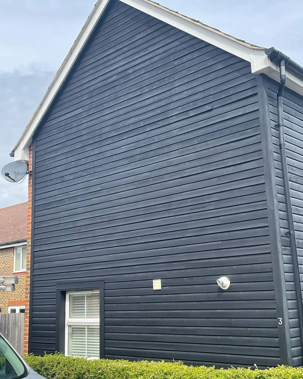 Exterior of house painted dark grey