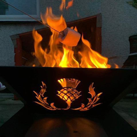 Lit fire pit with marshmallows