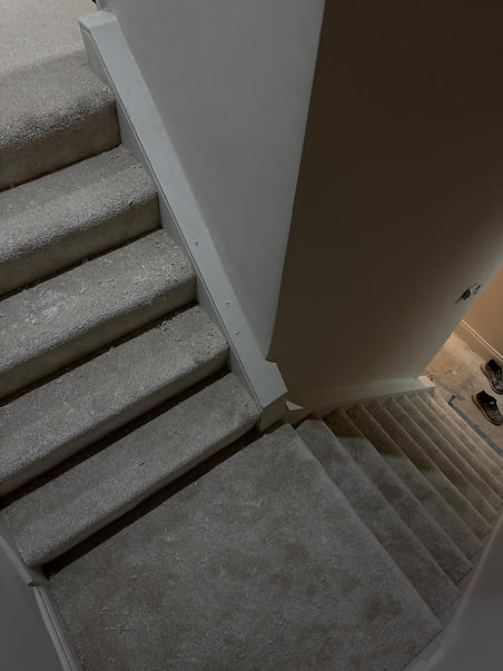 Light grey carpet installed in stairway