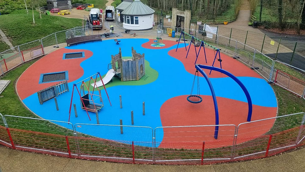 Colourful safety floor being installed in large park