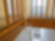 Wooden stair railing decorated with festive greenery in a home interior