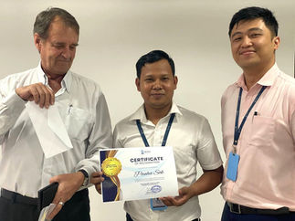 Employee holding a certificate