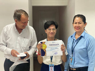 Employee holding a certificate