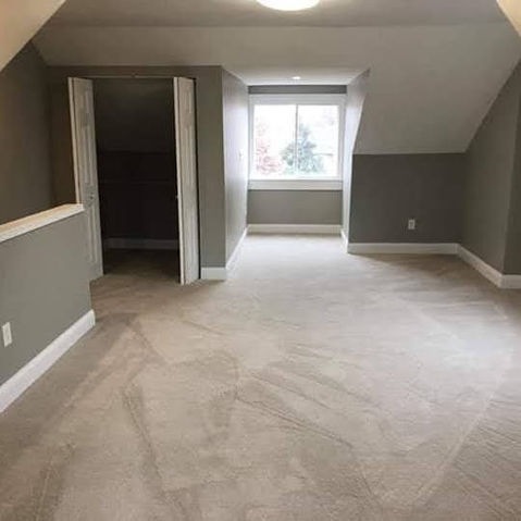 Finished room with carpet flooring and white trim.
