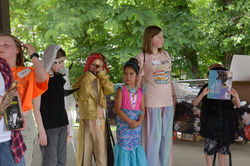 People in book character costumes