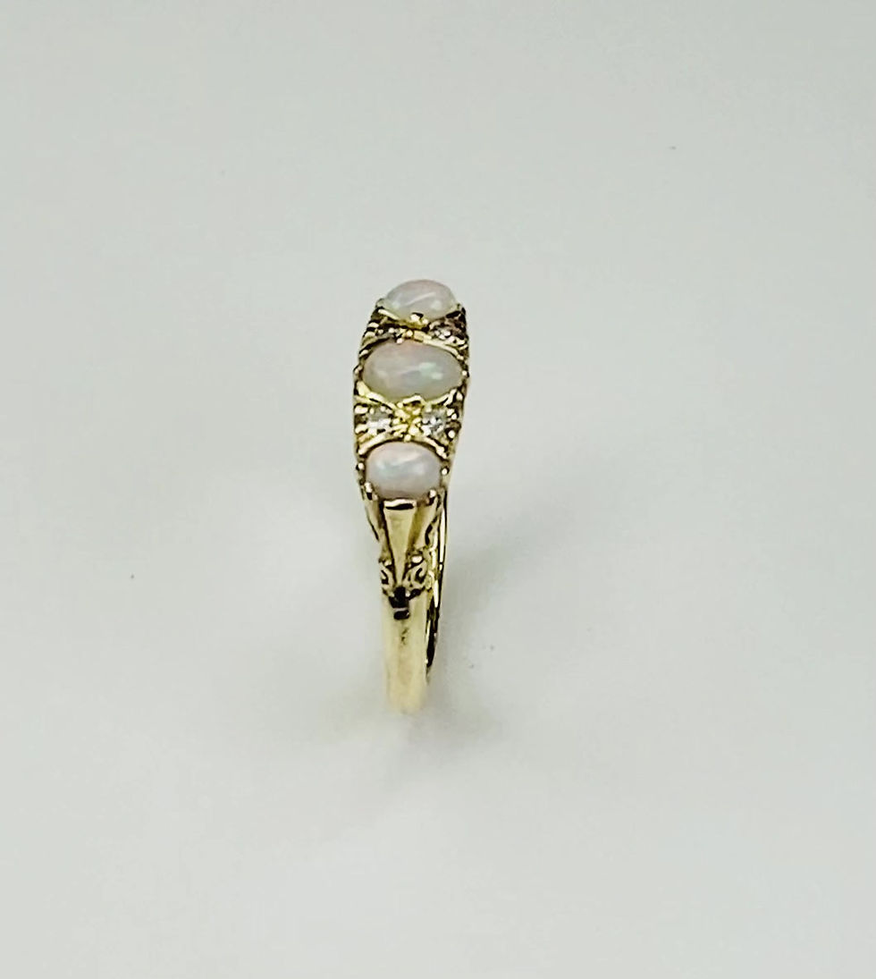Thumbnail: Opal and Diamond ring mounted in 18ct gold.