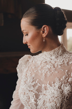 Bride laughing with bridesmaids during wedding preparations at Forbes of Kingennie