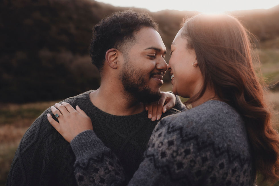 Cinematic destination couple photoshoot in Edinburgh, intimate and emotional portrait in a natural Scottish landscape. Holyrood