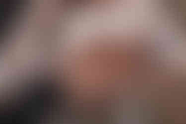 Romantic wedding elopement in Dean Village, Edinburgh, captured by a professional wedding photographer with scenic river views.