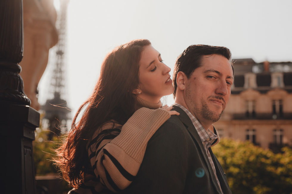 Romantic cinematic photography of a couple in Paris, highlighting soft light and emotional connection