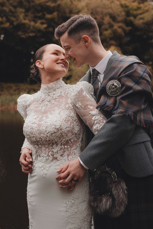 Bride and groom walking together in Scottish countryside at Forbes of Kingennie