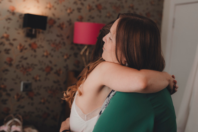 Bride getting ready in Edinburgh, capturing makeup, dress details, and first look moments for City Chambers wedding