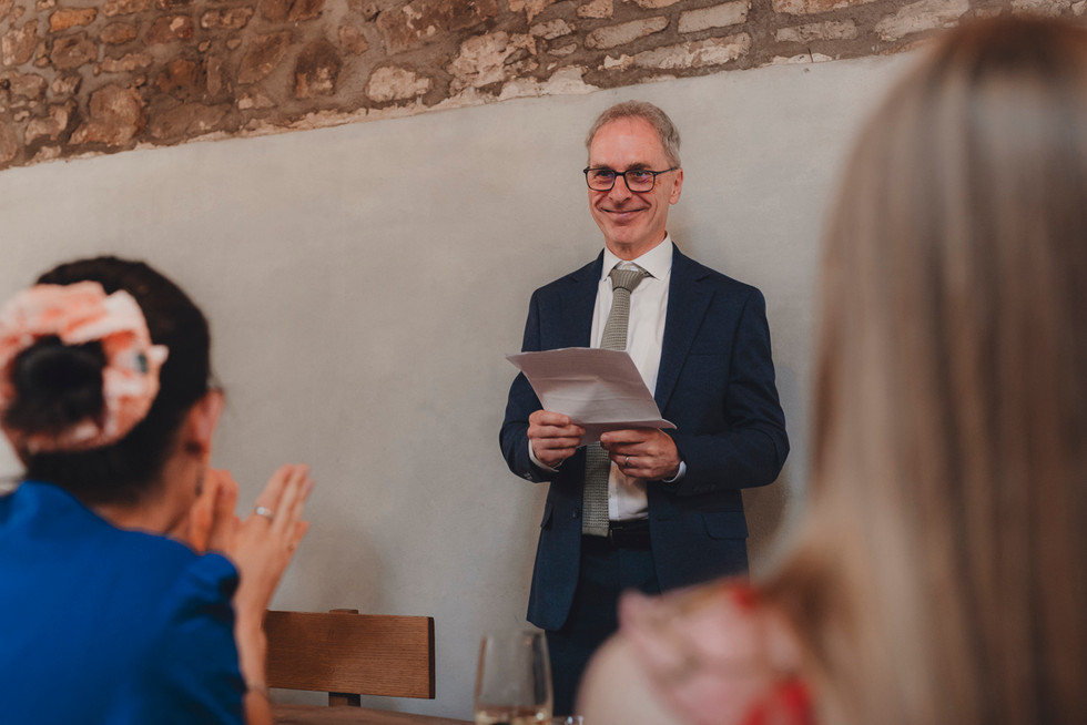 Guests enjoying speeches and laughter – editorial and fine art wedding photography in Scotland.