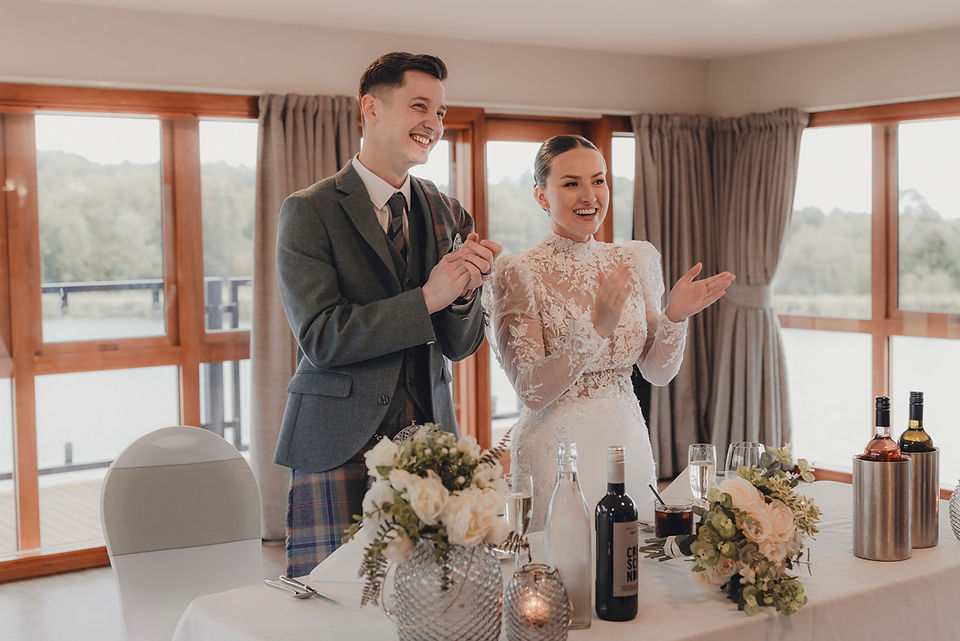 Candid wedding reception moments with guests laughing and cheering