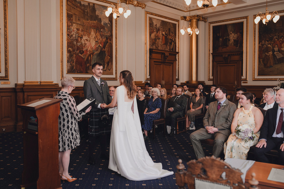 Romantic and intimate wedding ceremony captured in European Room, City Chambers, Edinburgh