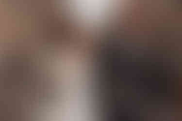 Bride and groom portraits along colorful Victoria Street, Edinburgh, joyful and cinematic wedding photography