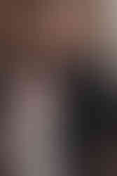 Romantic wedding elopement captured by a photographer along Victoria Street in Edinburgh, with colorful Victorian buildings and cobbled streets.