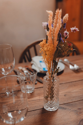 Flowers, decor, and reception tables at a relaxed Scotland countryside wedding photographed by a Scotland wedding photographer.