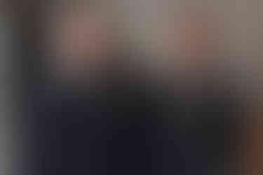 Edinburgh wedding groom prep portraits, showing suit, cufflinks, and joyful anticipation