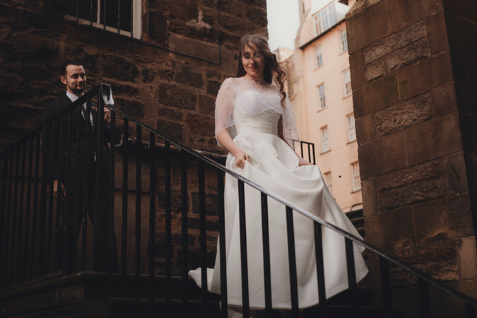 Couple enjoying a romantic wedding elopement near the Writers’ Museum in Edinburgh, photographed to capture historic charm and storytelling atmosphere