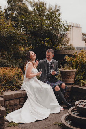 Editorial wedding photography of City Chambers couple celebrating at St Columba’s by the Castle, Edinburgh