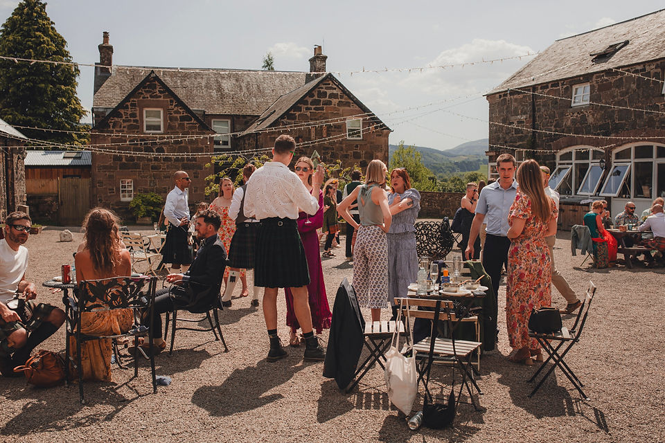 Natural drinks reception moments during a Scotland wedding photographed by a Scotland wedding photographer.