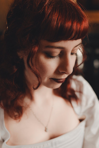 Bohemian bride getting ready at Dalhousie Castle with elegant dress and romantic atmosphere