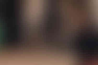 Groom in traditional Scottish kilt adjusting jacket before ceremony, captured at Dundas Castle by Garrigós & Golebiowski.