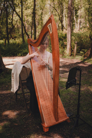 Woodland wedding ceremony at Comrie Croft captured by a Scotland wedding photographer.