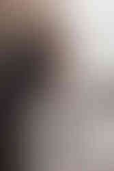 Romantic portrait of couple by the castle gates, natural and meaningful Scotland wedding photography.