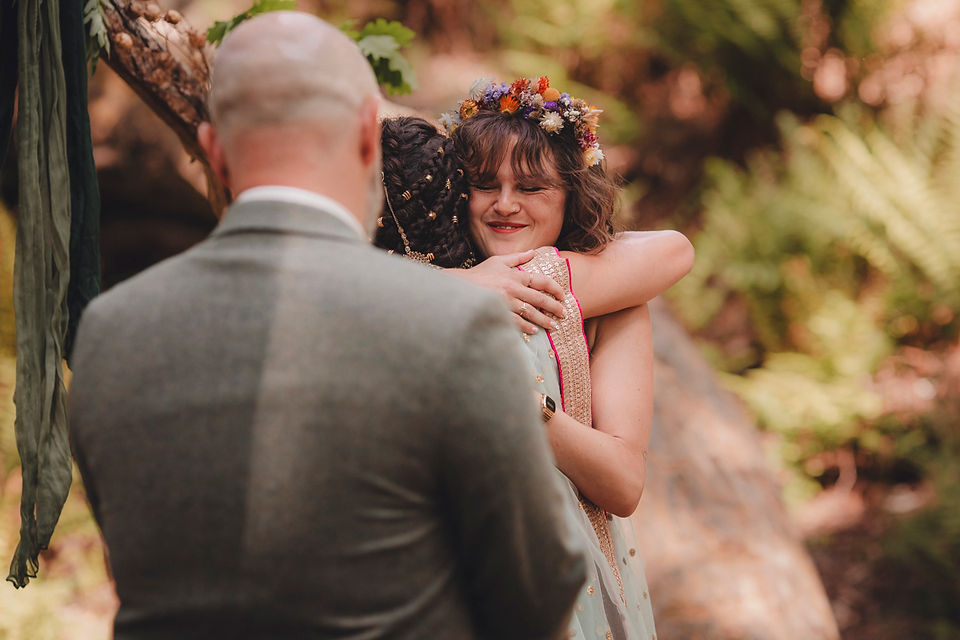 Woodland wedding ceremony at Comrie Croft captured by a Scotland wedding photographer.