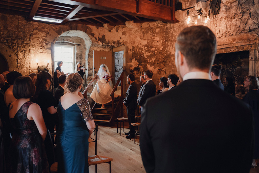 Bride and groom exchanging vows and rings in storytelling editorial style